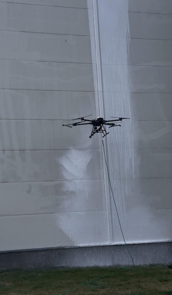 C10 drone cleaning the facade