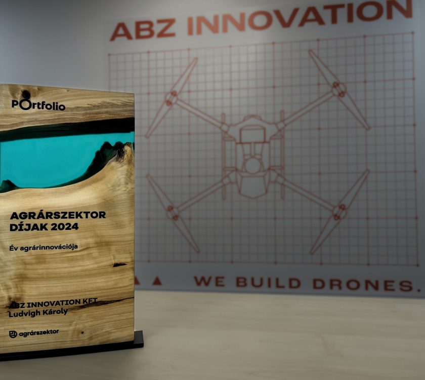 The award ABZ Innovation won with its logo in the background